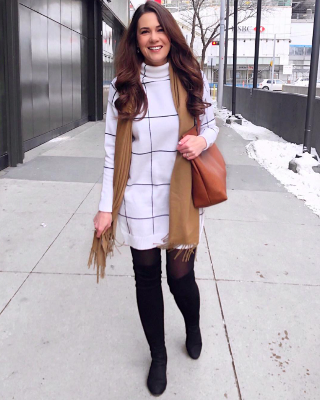 chicwish blogger wearing the grid print dress with black stockings, black boots, a brown scarf, and a brown abg