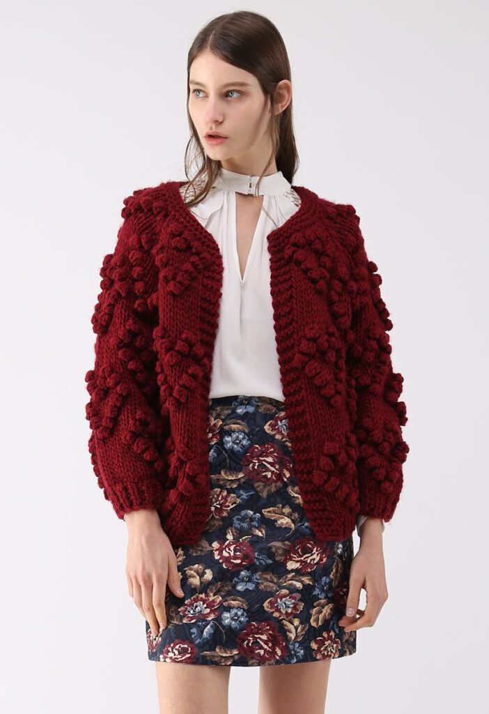 model wearing red knit cardigan that has lots of reviews